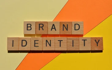 Scrabble letters forming the words "brand identity"