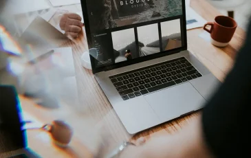 A laptop showing an example website.